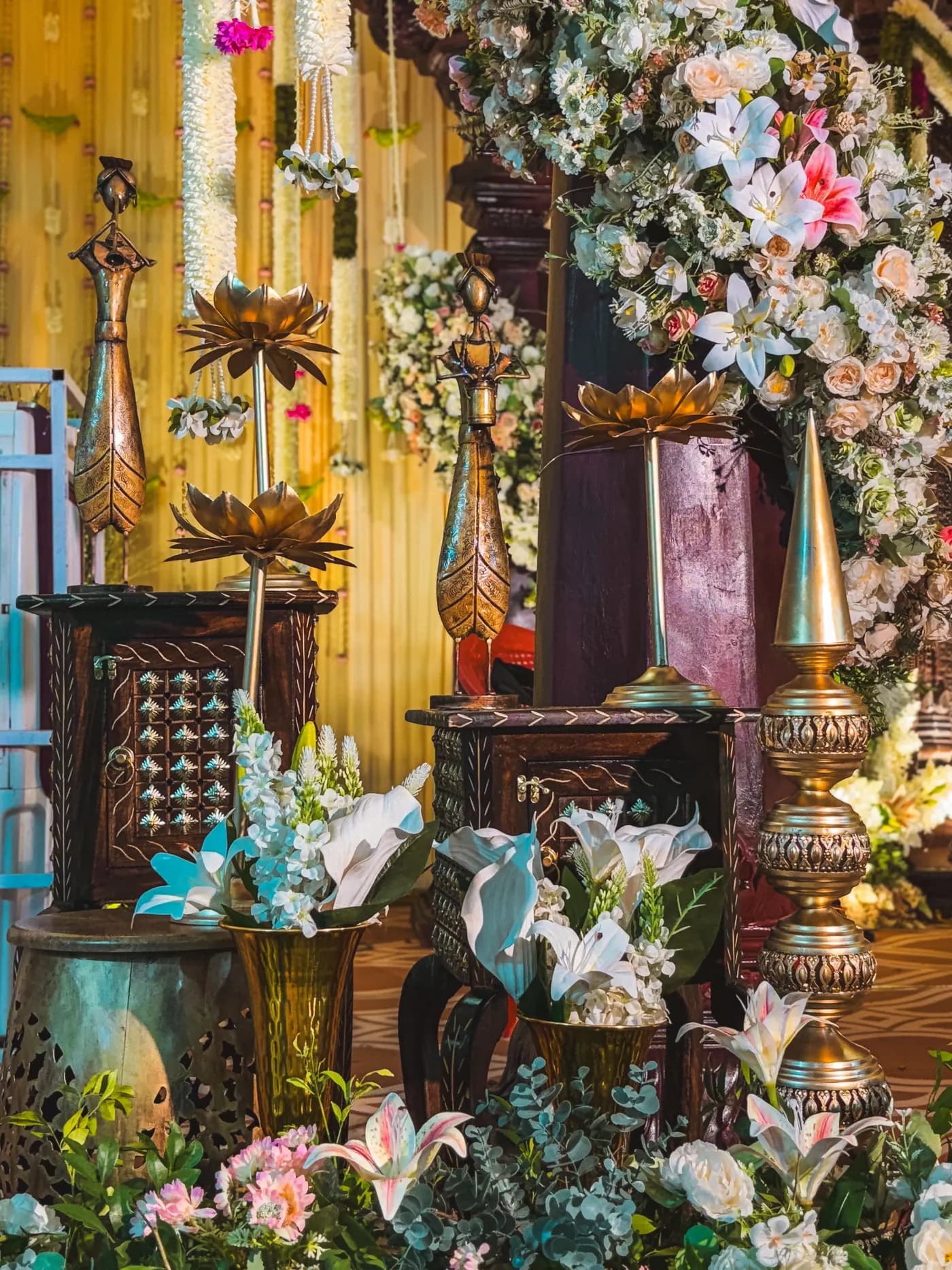 Brass lamps and floral detailing by Garuda